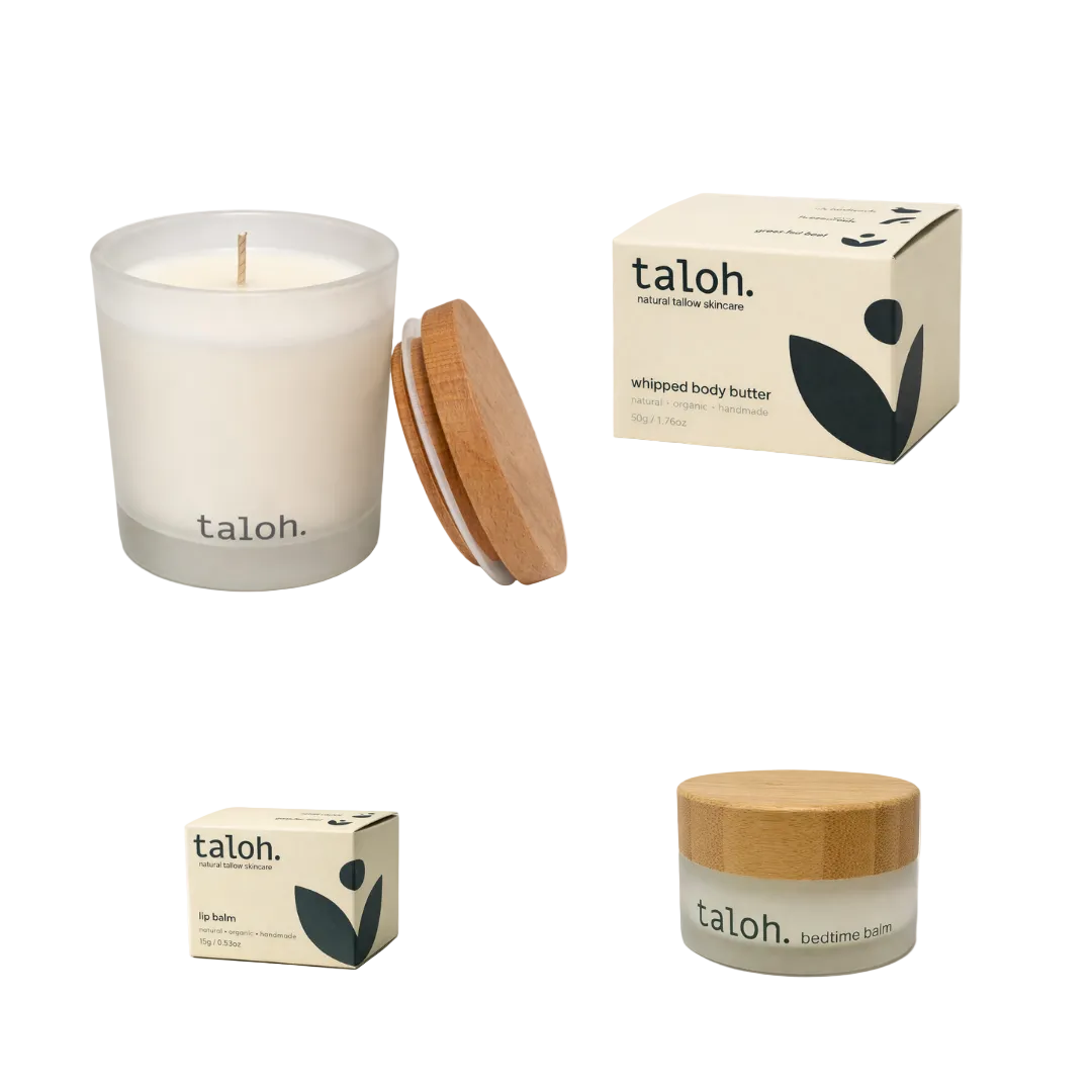 Taloh natural soy candle, jar, and boxes of 100% grass-fedtallow beef based skincare on a white background