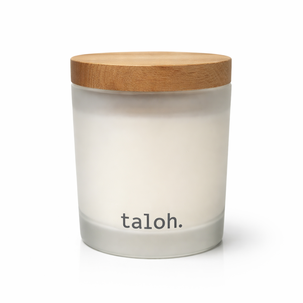 White frosted glass candle jar with wooden lid on a white background, featuring the brand 'taloh'.